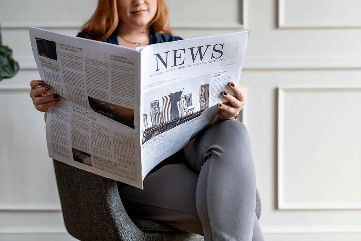 A woman reading the newspaper