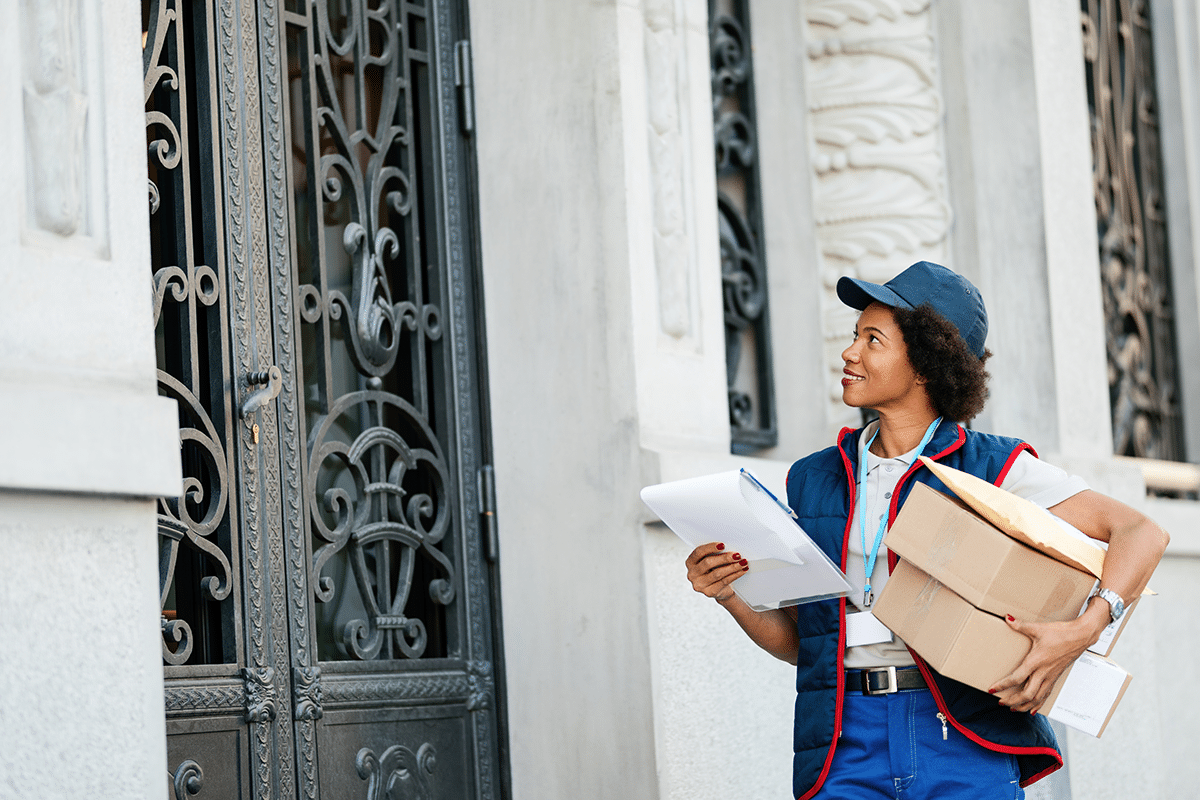 Postal worker delivering mail